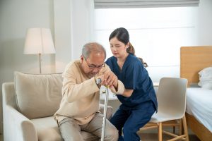Assisted living staff offering emotional support to senior residents through companionship and meaningful interactions in a warm, welcoming environment.